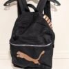 sac à dos Puma semble neuf, malgré les attaches de zip décolorés